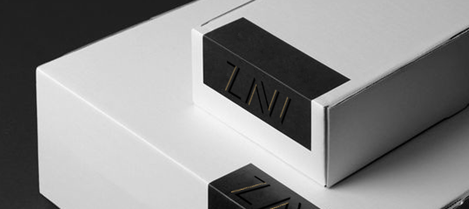 Premium brand identity design — minimalist product packaging with gold logo detail by OH! Design Studio
